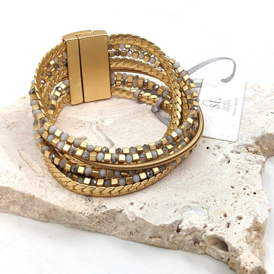 MULTI CHAIN STATEMENT MAGNETIC BRACELET WITH SOME BEADED STRANDS